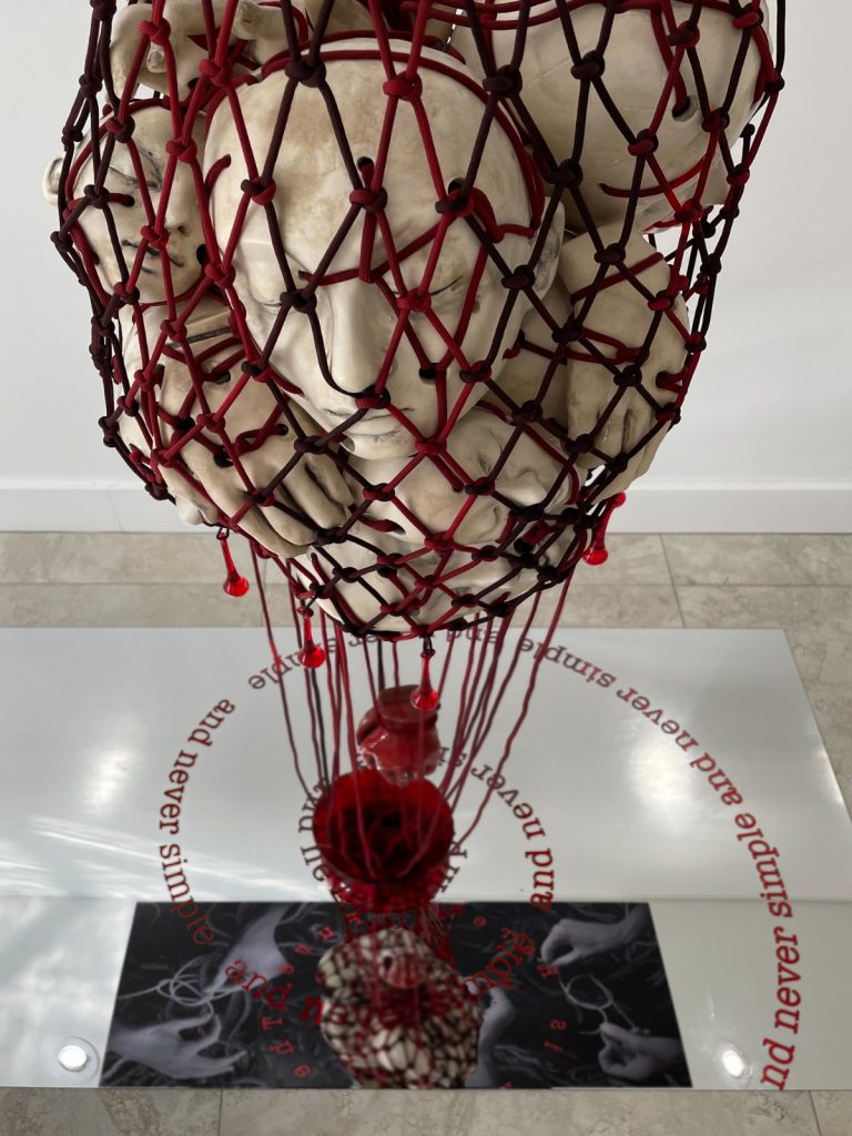 "The Truth is rarely pure". 2022. 10’ H x 4’ L x 30” Deep, Ceramic, fiber, metal, photography & mirror